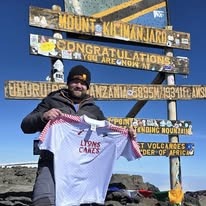 Elliot at the summit of Mount Kilimanjaro, October 2024