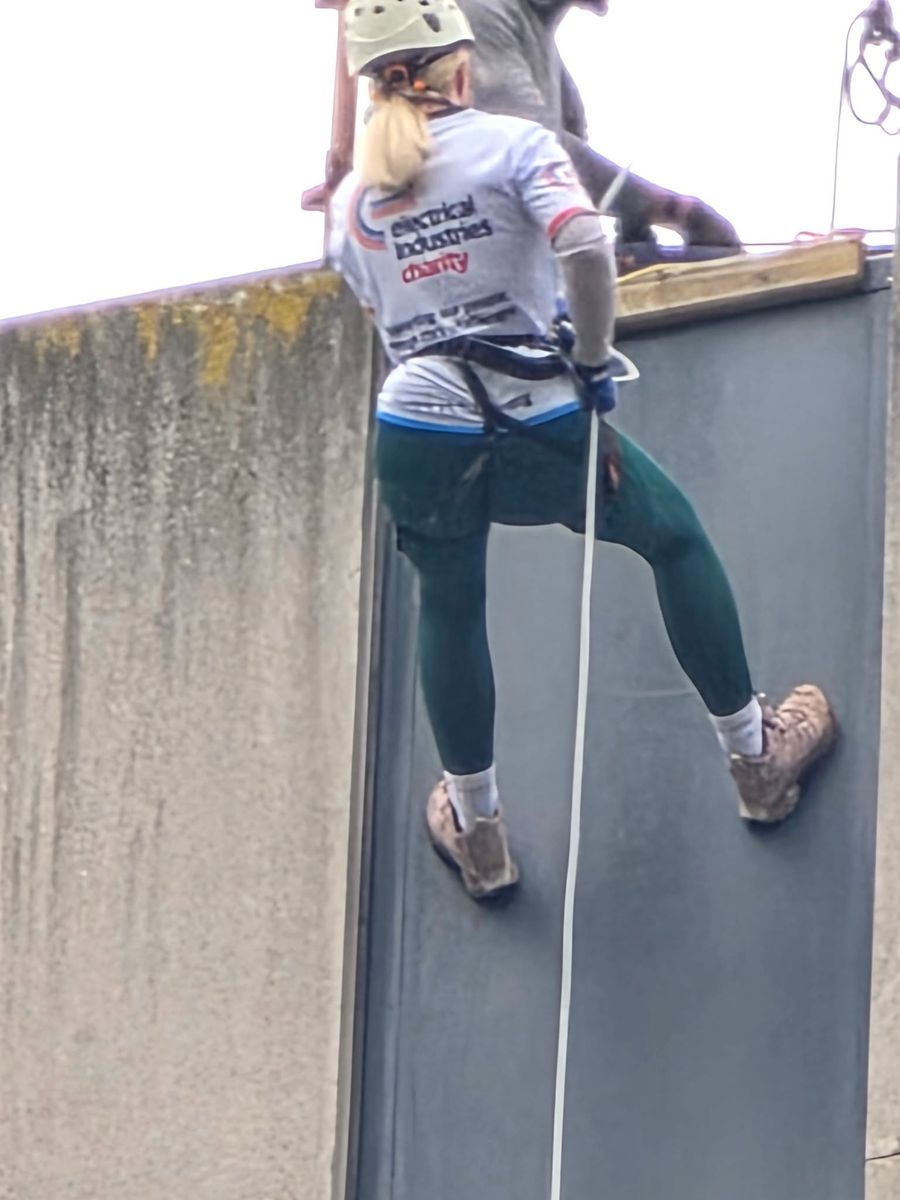 Zoe abseiling the Europa Hotel in Belfast for the Electrical Industries Charity